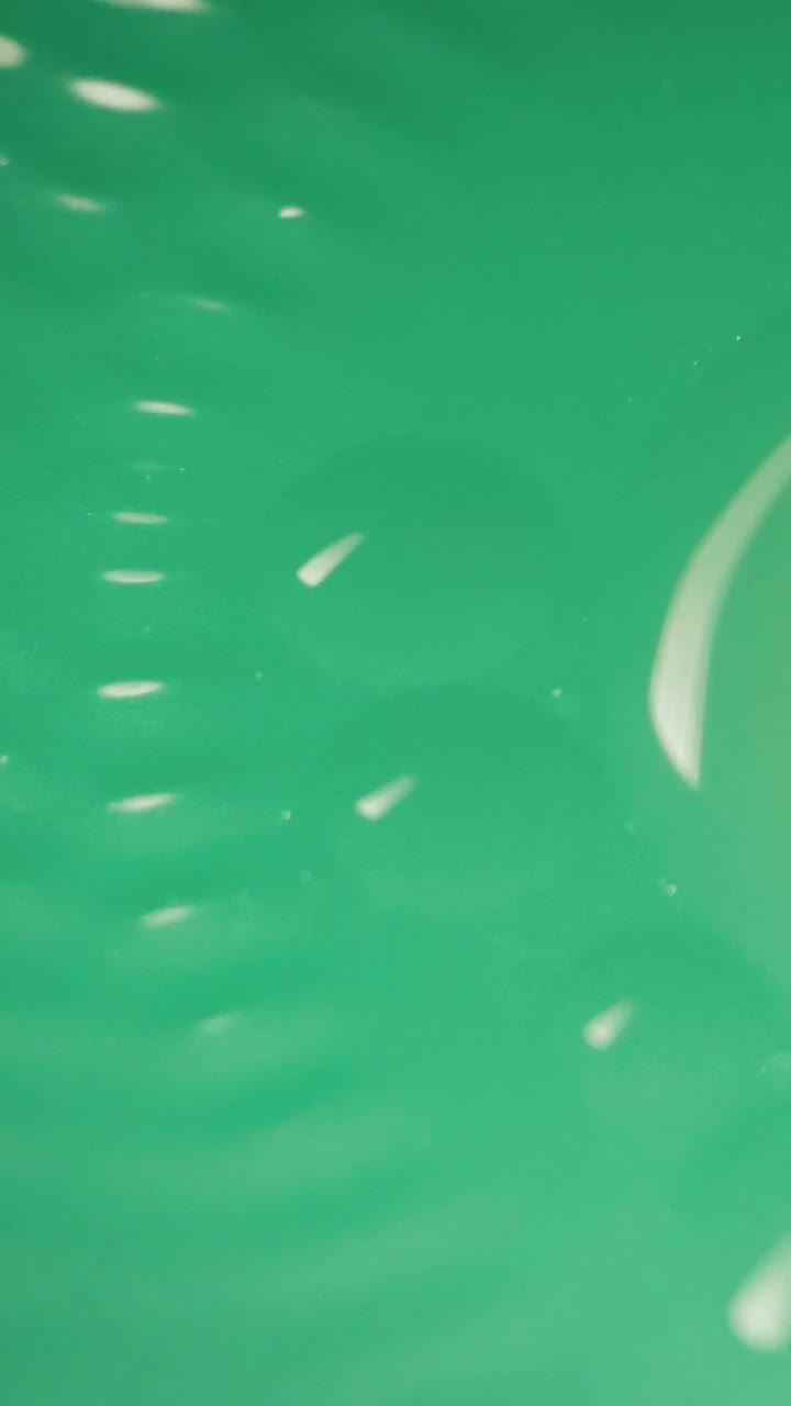 Free Video Stock texture of a turquoise green colored substance Live Wallpaper