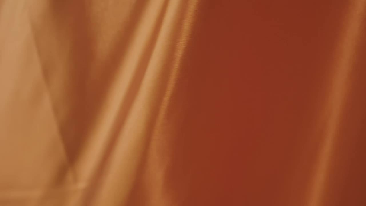 Free Video Stock texture of an orange fabric while waving Live Wallpaper