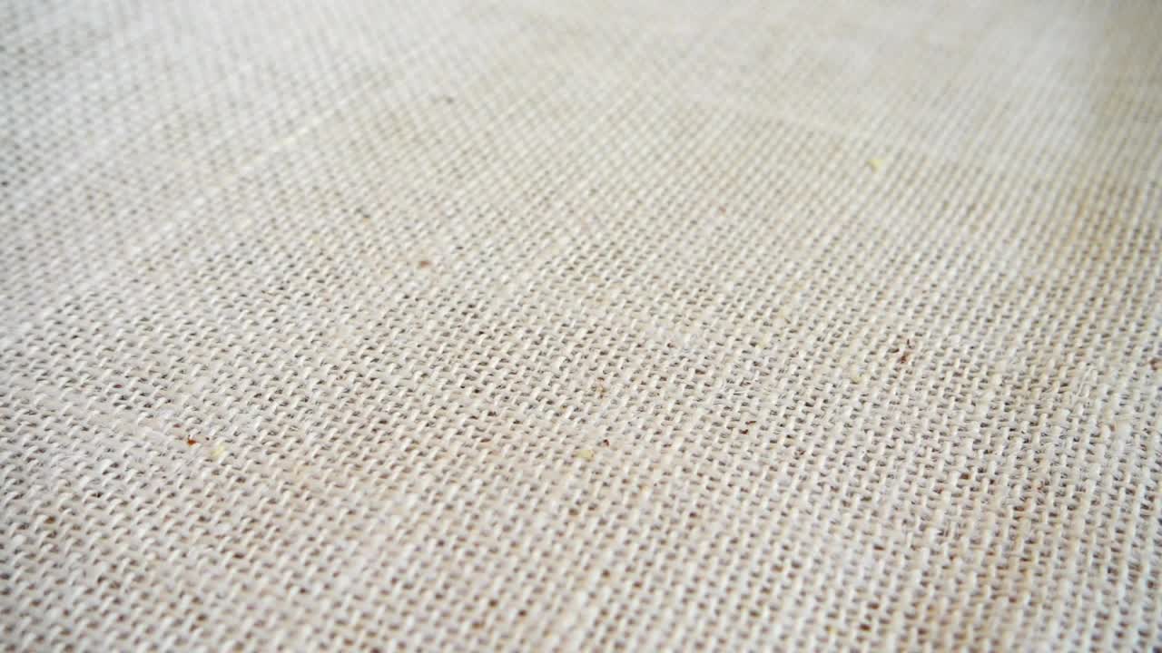 Free Video Stock texture of brazil nuts falling on a tablecloth Live Wallpaper