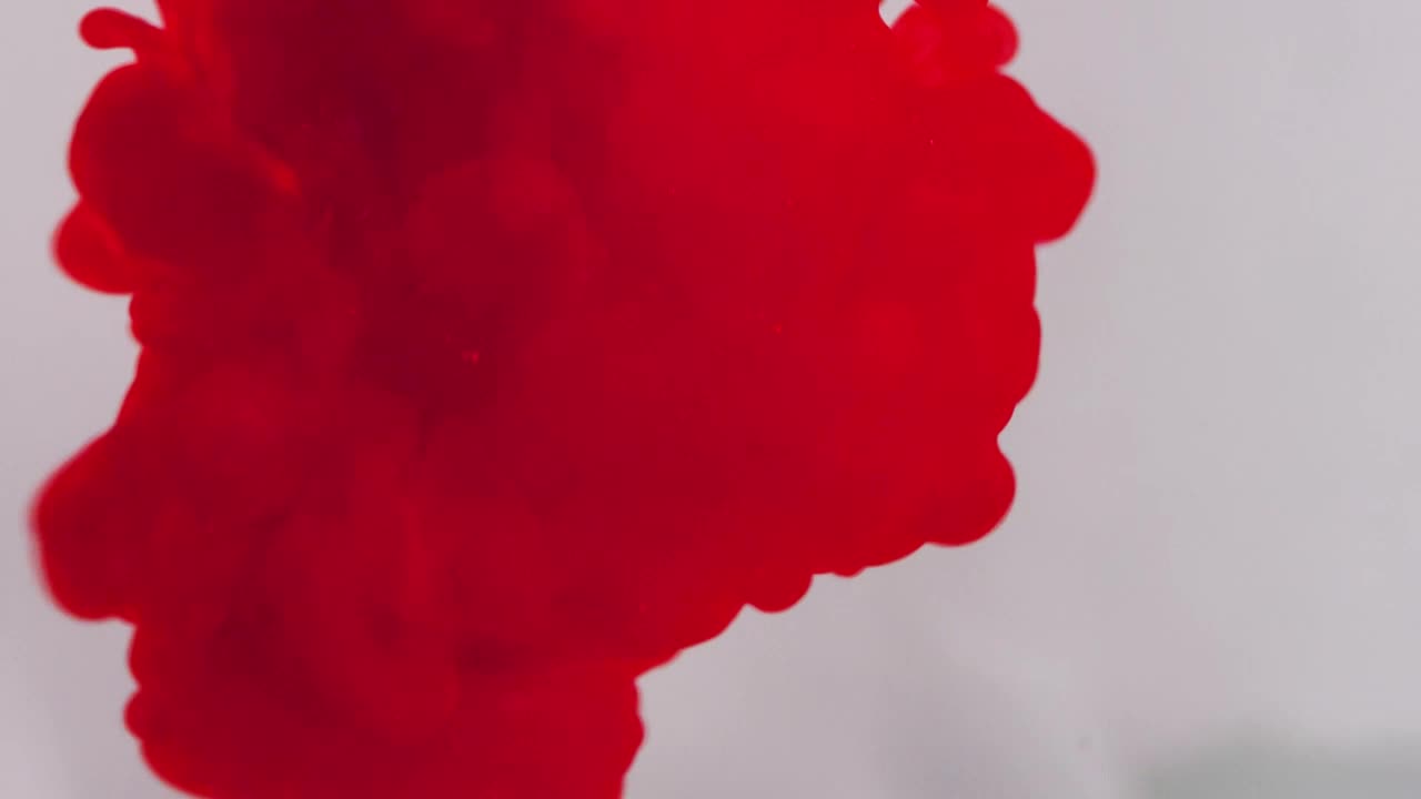 Free Video Stock texture of red ink in water on a white background Live Wallpaper