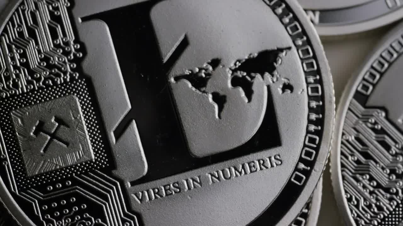 Free Video Stock texture of silver litecoin coins slowly rotating Live Wallpaper