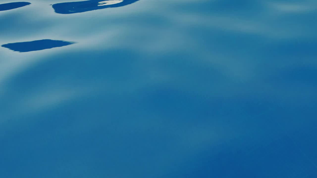 Free Video Stock texture of water moving in a swimming pool Live Wallpaper