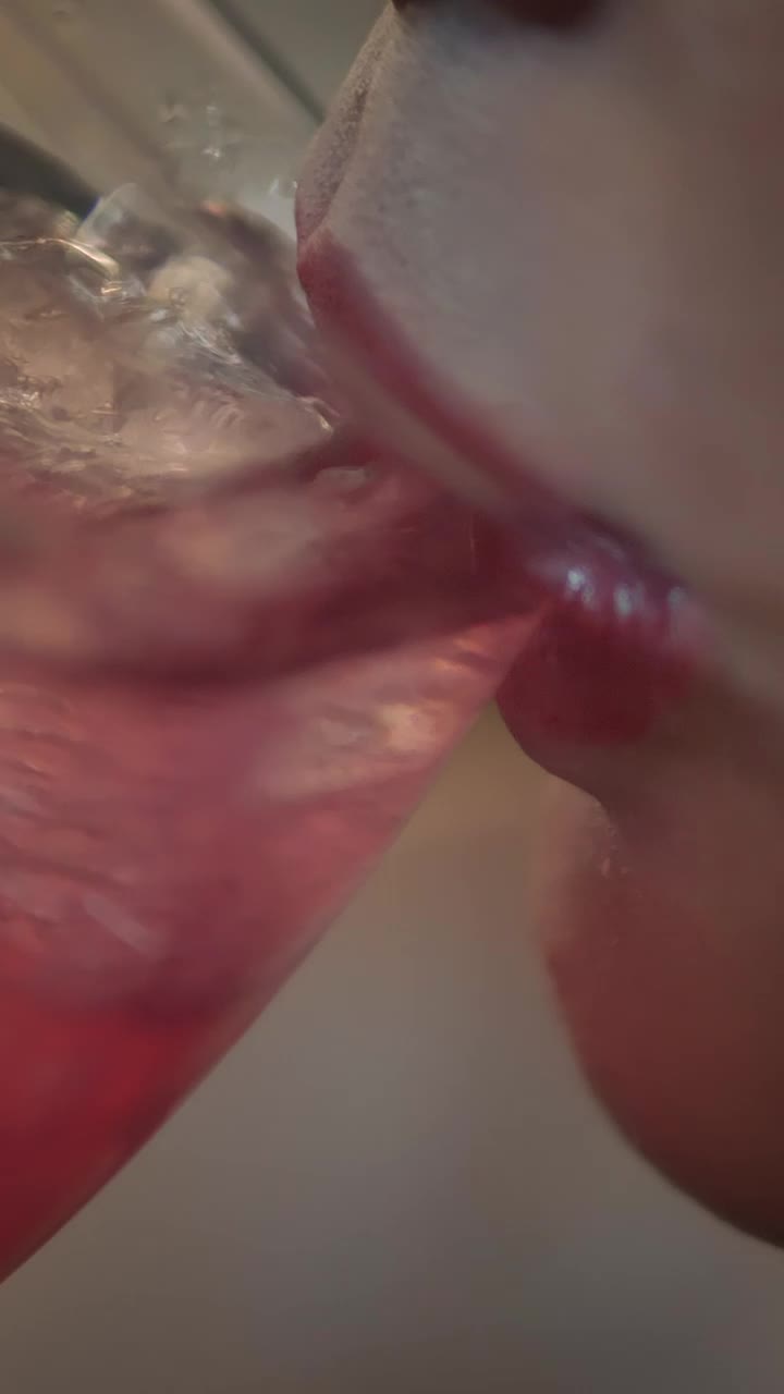 Free Video Stock the mouth of a woman taking a cocktail Live Wallpaper