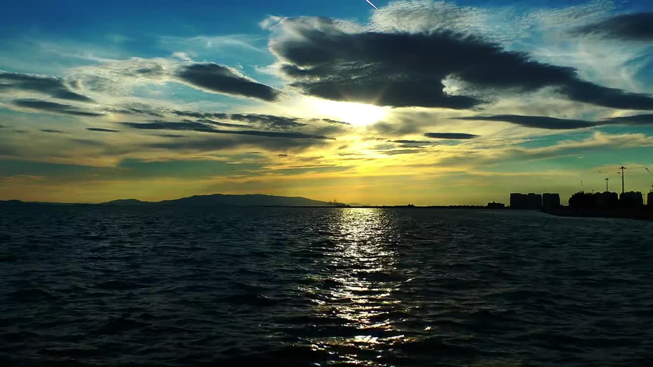 Free Video Stock the sea the sky and a city on horizon Live Wallpaper