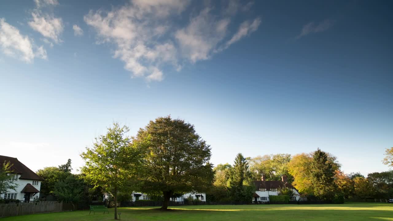 Free Video Stock the sky above the houses of an english village Live Wallpaper