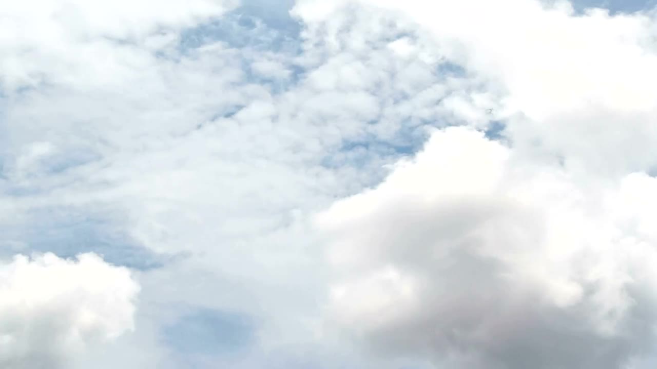 Free Video Stock thick white clouds above a city Live Wallpaper