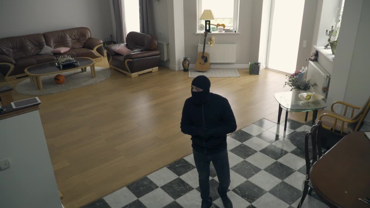 Free Video Stock thief creep through house and looks up at camera Live Wallpaper