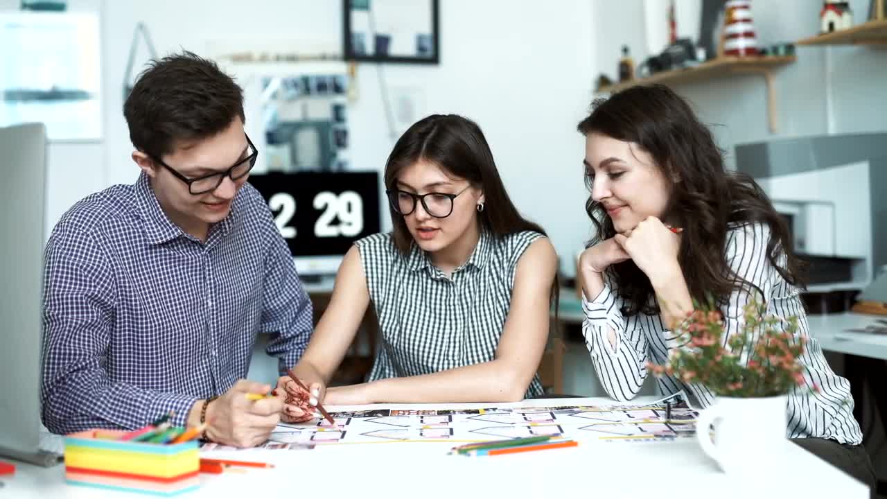 Free Video Stock three architects discussing a blueprint Live Wallpaper