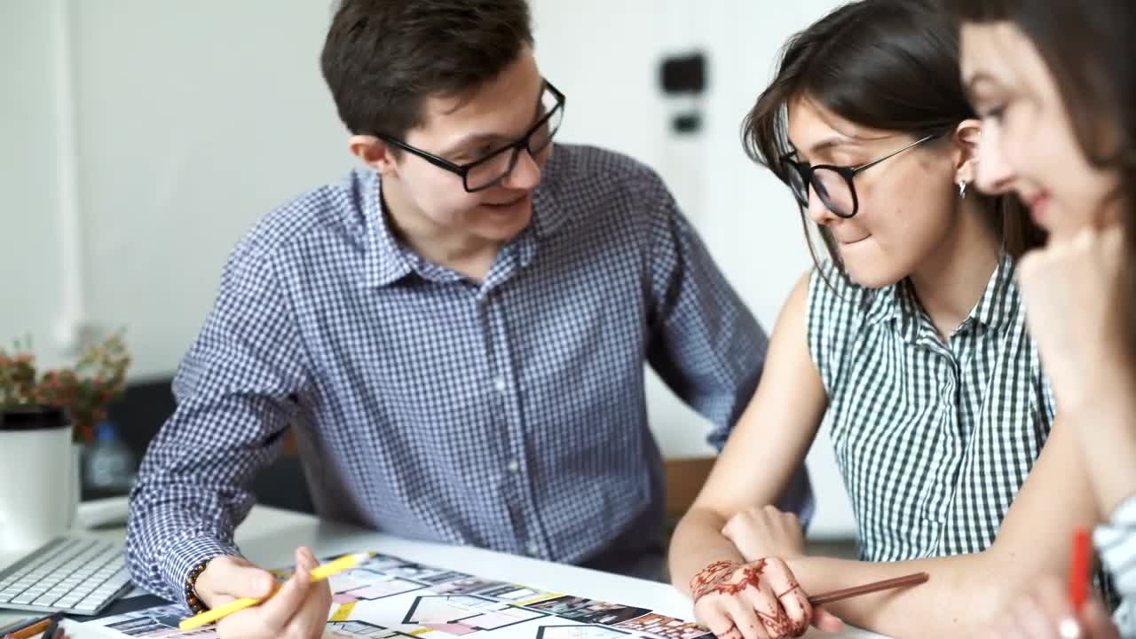 Free Video Stock three architects working on a blueprint Live Wallpaper