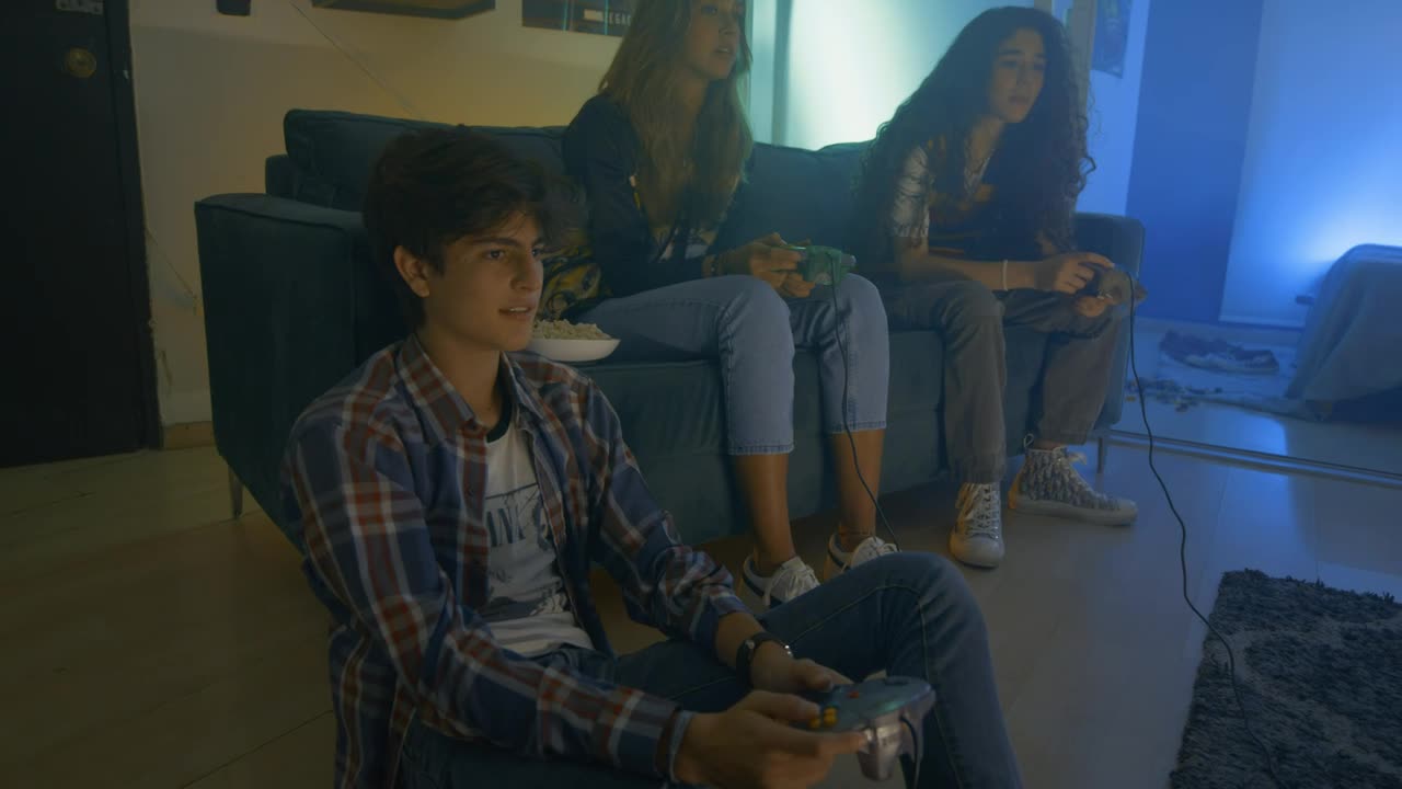 Free Video Stock three friends playing video games at night Live Wallpaper