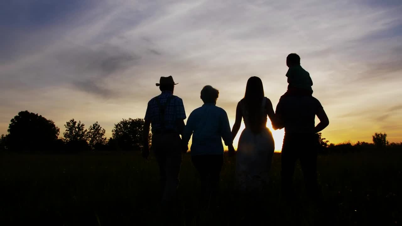 Free Video Stock three generations walking together at sunset Live Wallpaper