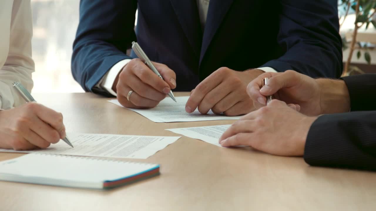 Free Video Stock three persons signing contracts Live Wallpaper