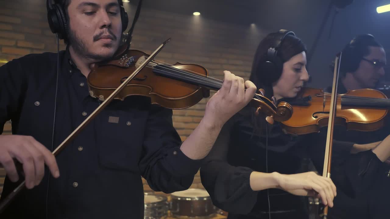 Free Video Stock three violinists playing together in a recording studio 41690Live Wallpaper