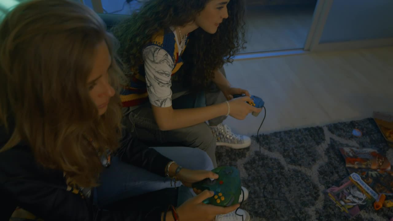 Free Video Stock three young friends gaming in the living room Live Wallpaper