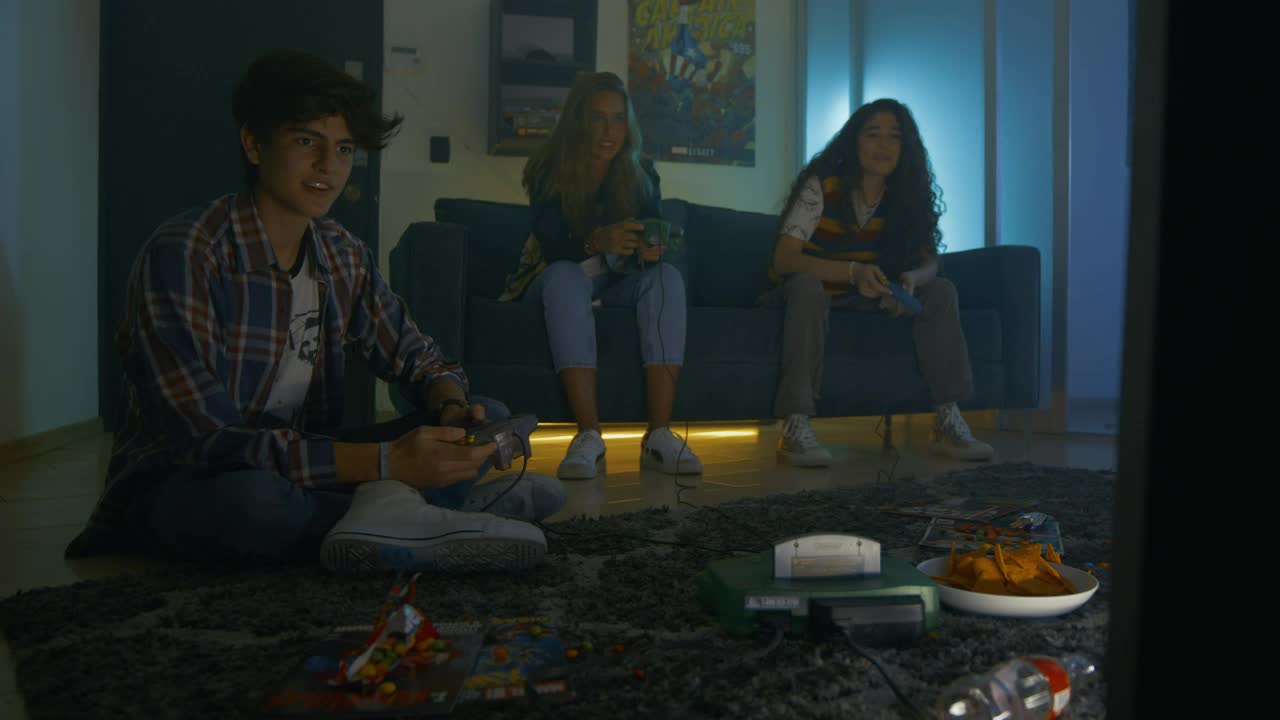 Free Video Stock three young friends playing video games Live Wallpaper