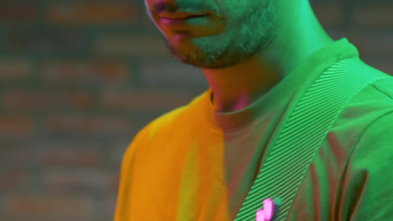 Free Video Stock tilt of a guitarist playing a song Live Wallpaper