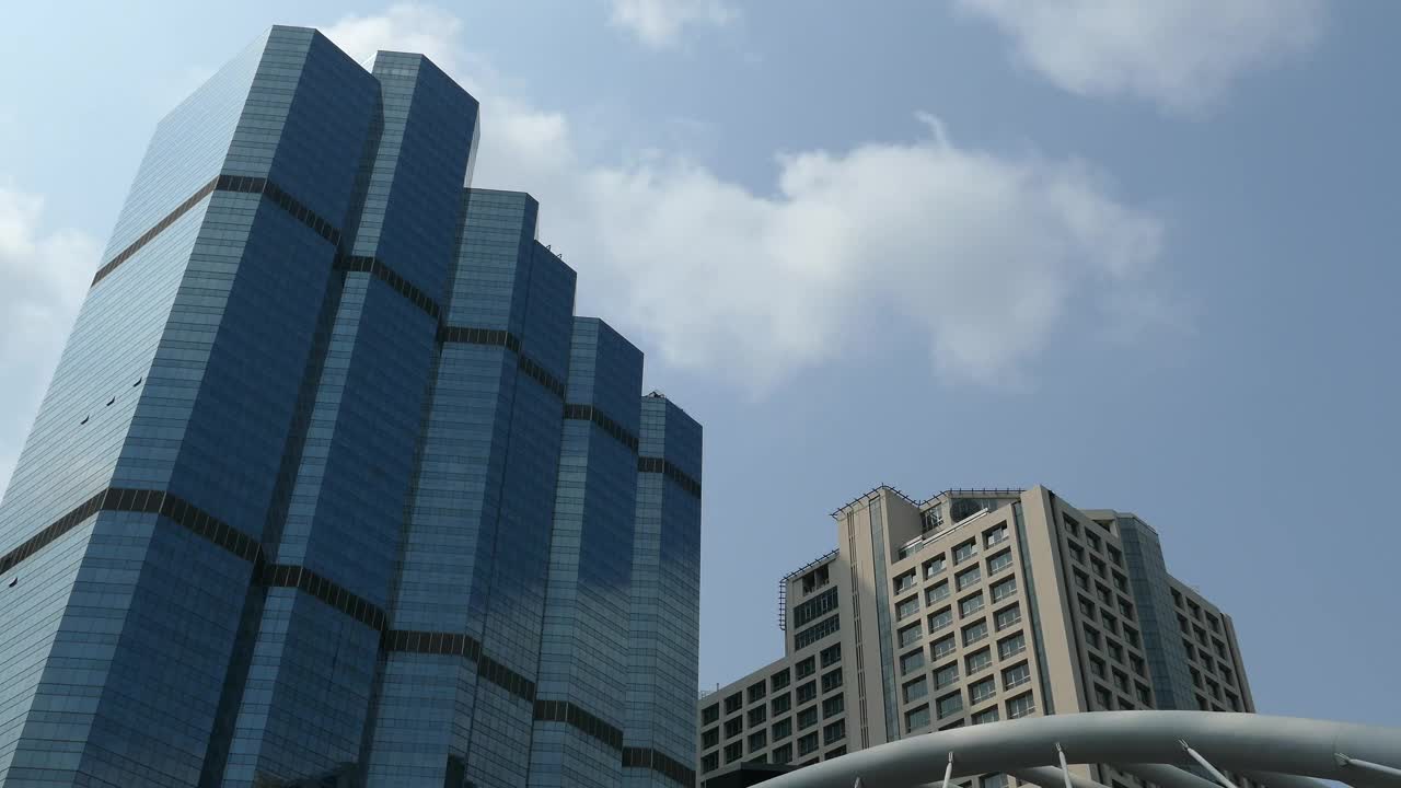 Free Video Stock time lapse of skyscrapers next to the sky walk in bangkok Live Wallpaper