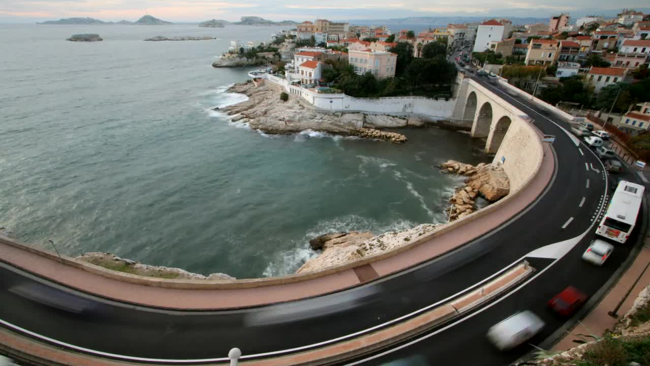 Free Video Stock time lapse of the coast with a street with traffic Live Wallpaper