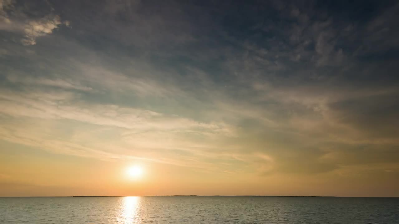 Free Video Stock time lapse of the sunrise before a storm at sea Live Wallpaper