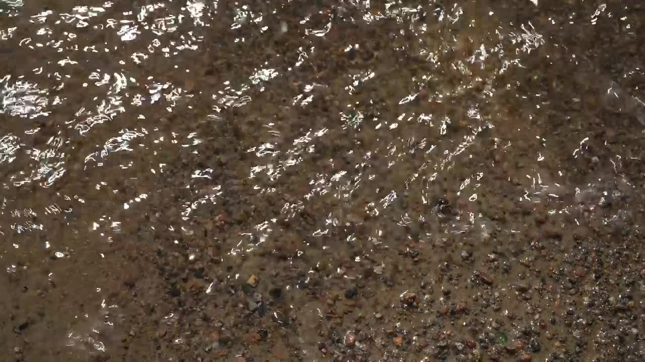 Free Video Stock tiny waves breaking on the shore Live Wallpaper