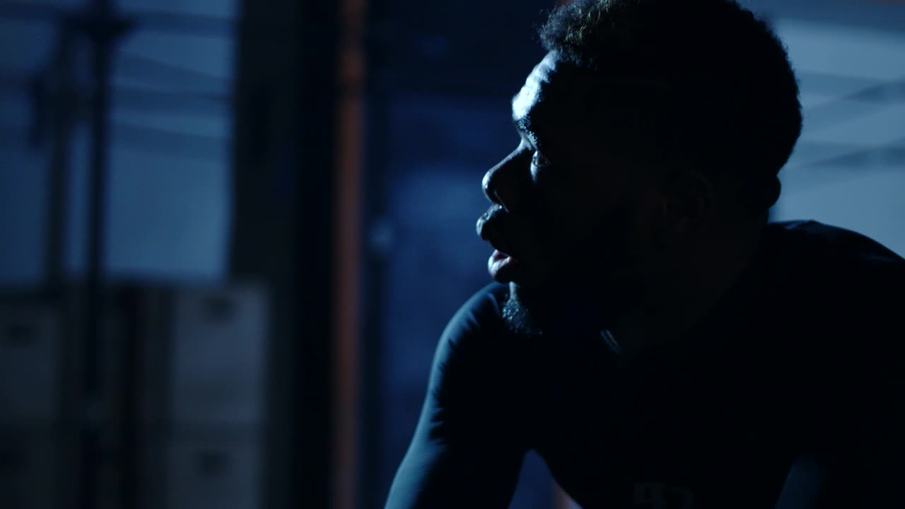 Free Video Stock tired athlete catching his breath at a gym Live Wallpaper