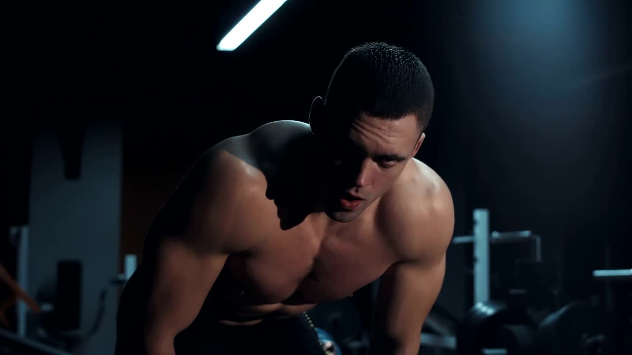 Free Video Stock tired athlete in a dark gym Live Wallpaper