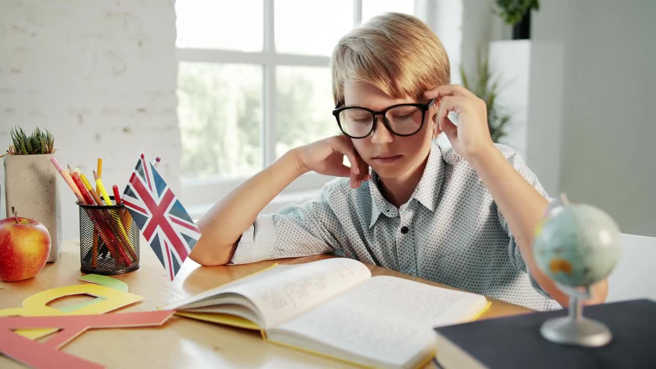 Free Video Stock tired boy studying at home Live Wallpaper