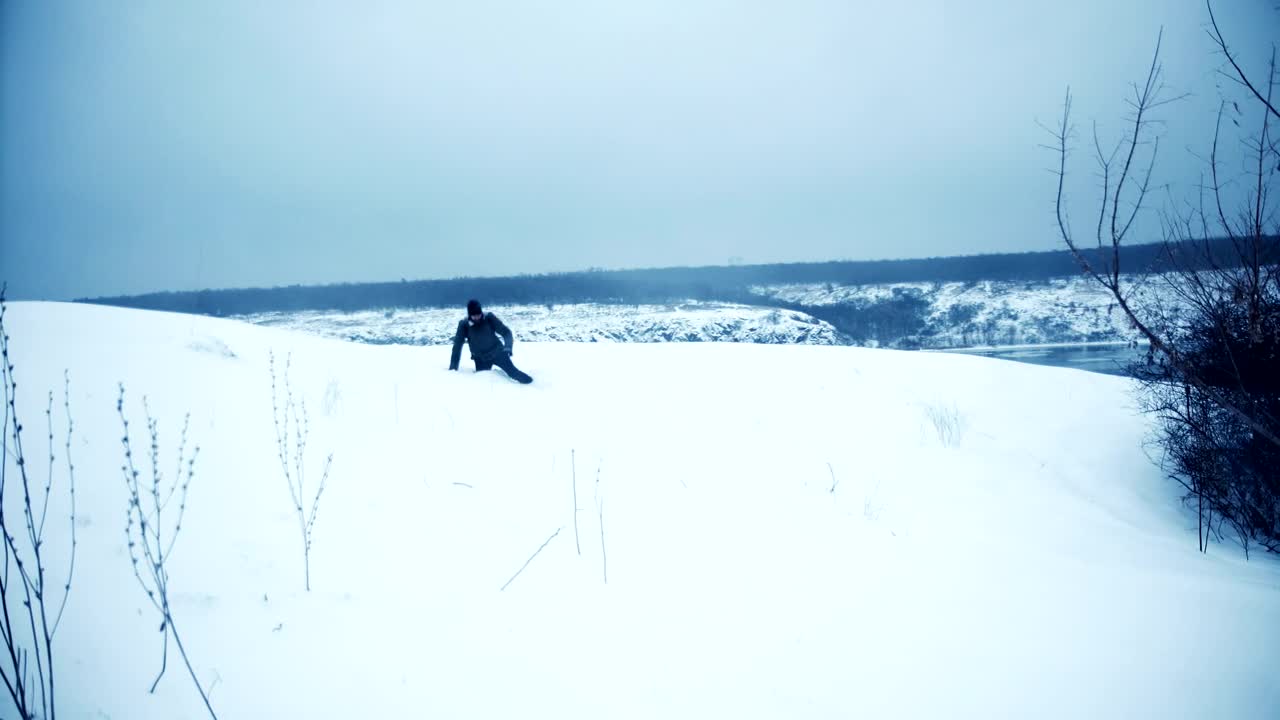 Free Video Stock tired man falls in the snow Live Wallpaper