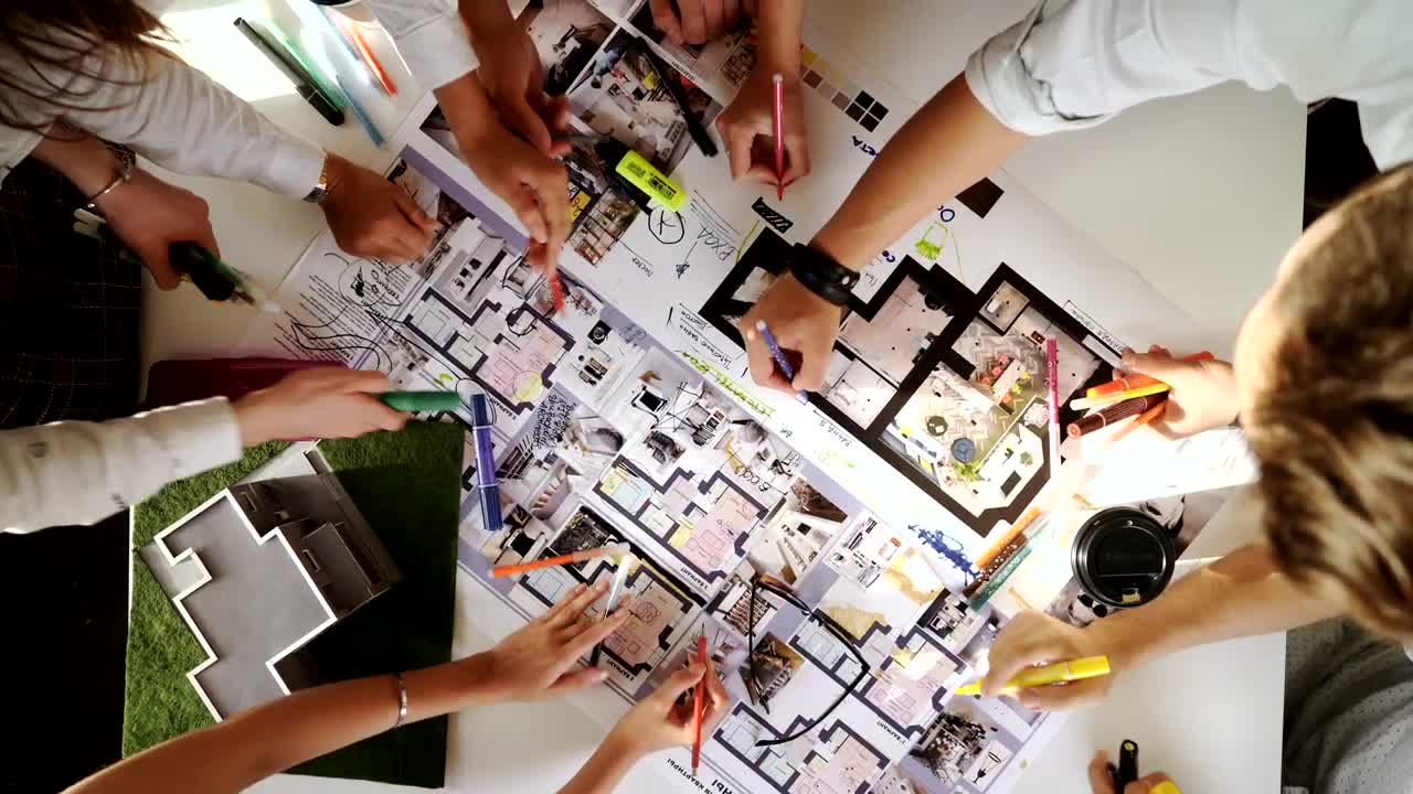 Free Video Stock top view of creative architects working on a project Live Wallpaper