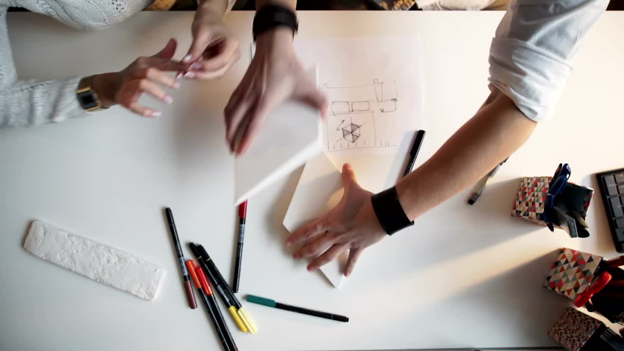 Free Video Stock top view of creative hands working on paper models and Live Wallpaper