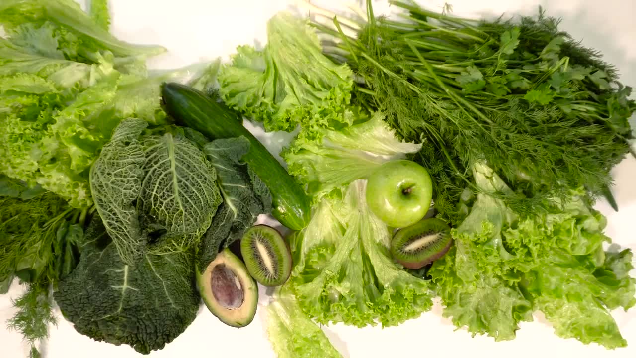 Free Video Stock top view of green fruits and veg on table Live Wallpaper