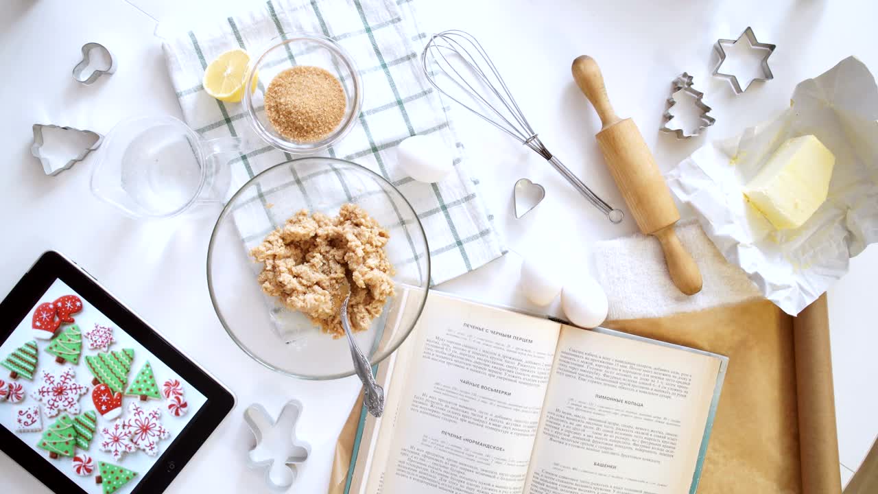 Free Video Stock top view of woman making cookies from recipe on tablet Live Wallpaper