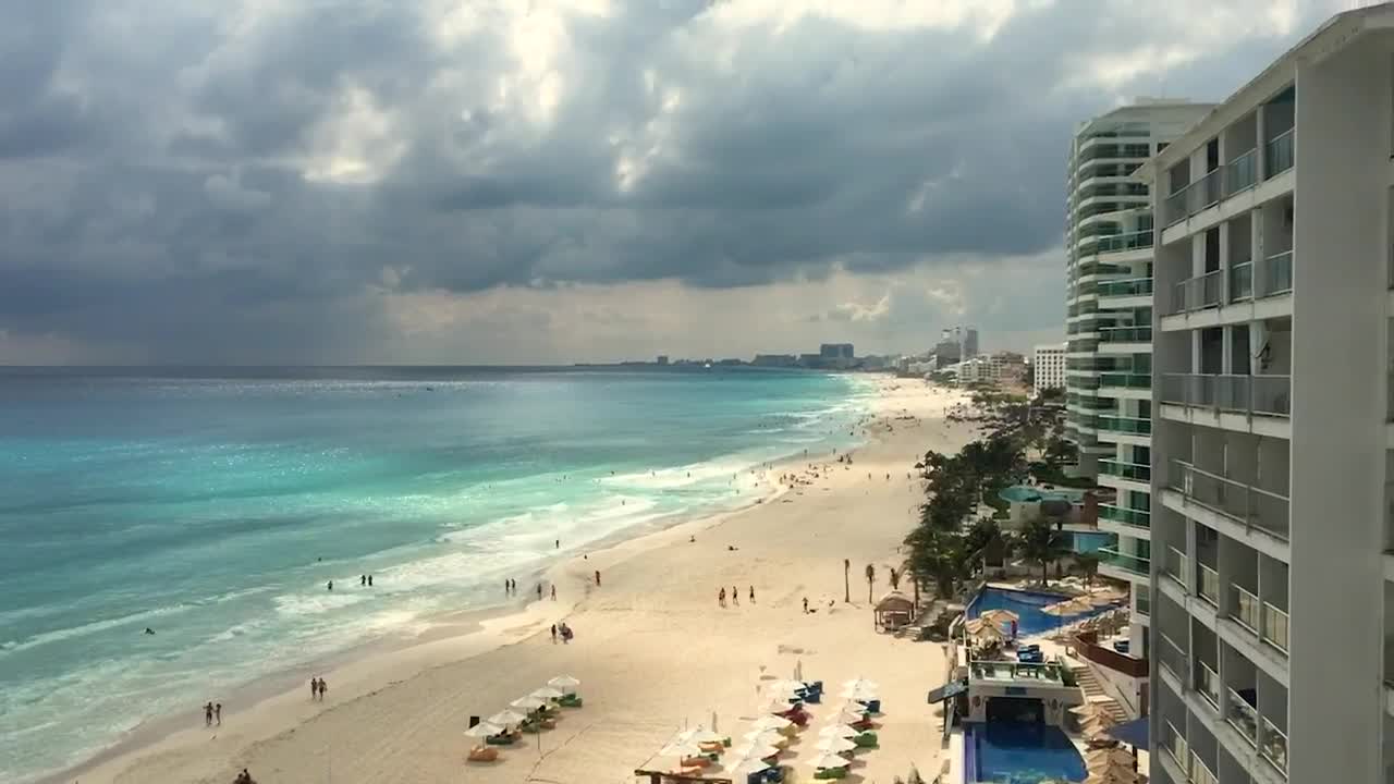 Free Video Stock tourist beach in front of the hotel zone Live Wallpaper