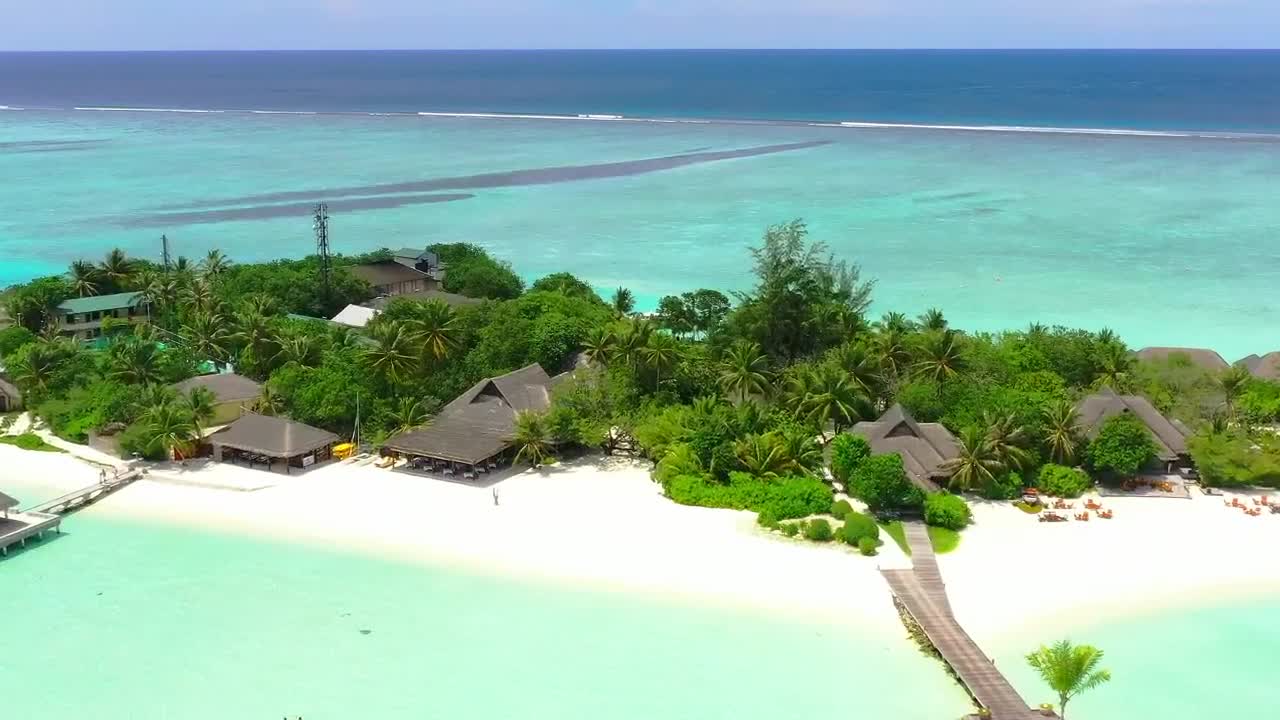 Free Video Stock tourist island with a pier and bungalows Live Wallpaper