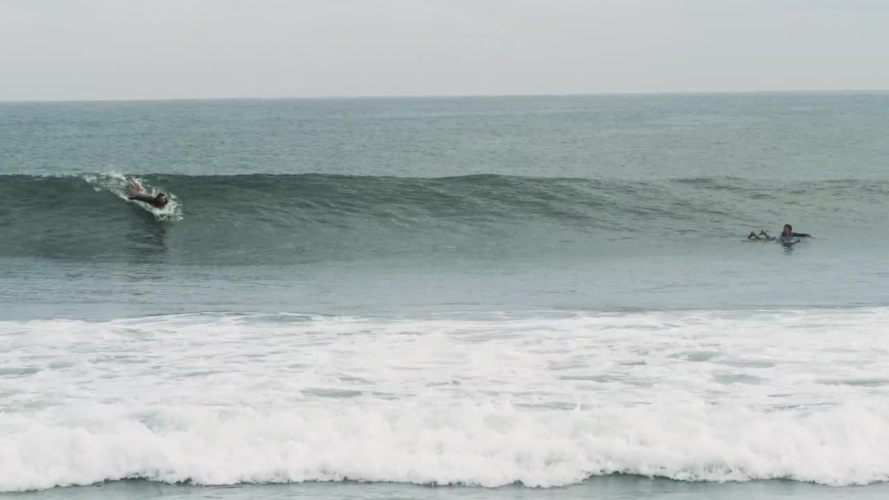 Free Video Stock tracking shot of a person surfing waves Live Wallpaper