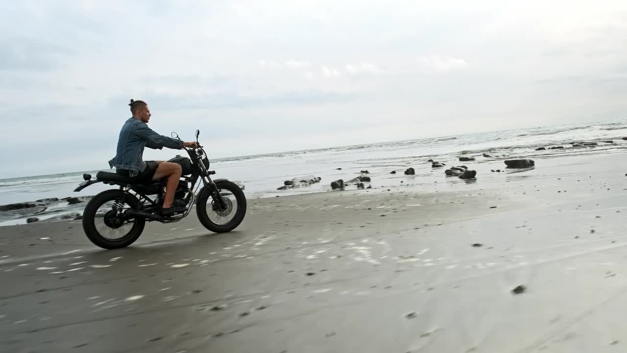 Free Video Stock tracking shot of a wanderlust riding a motorbike at the Live Wallpaper