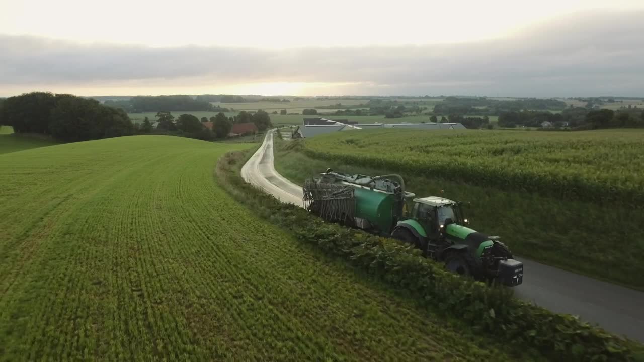 Free Video Stock tractor driving on a country road Live Wallpaper