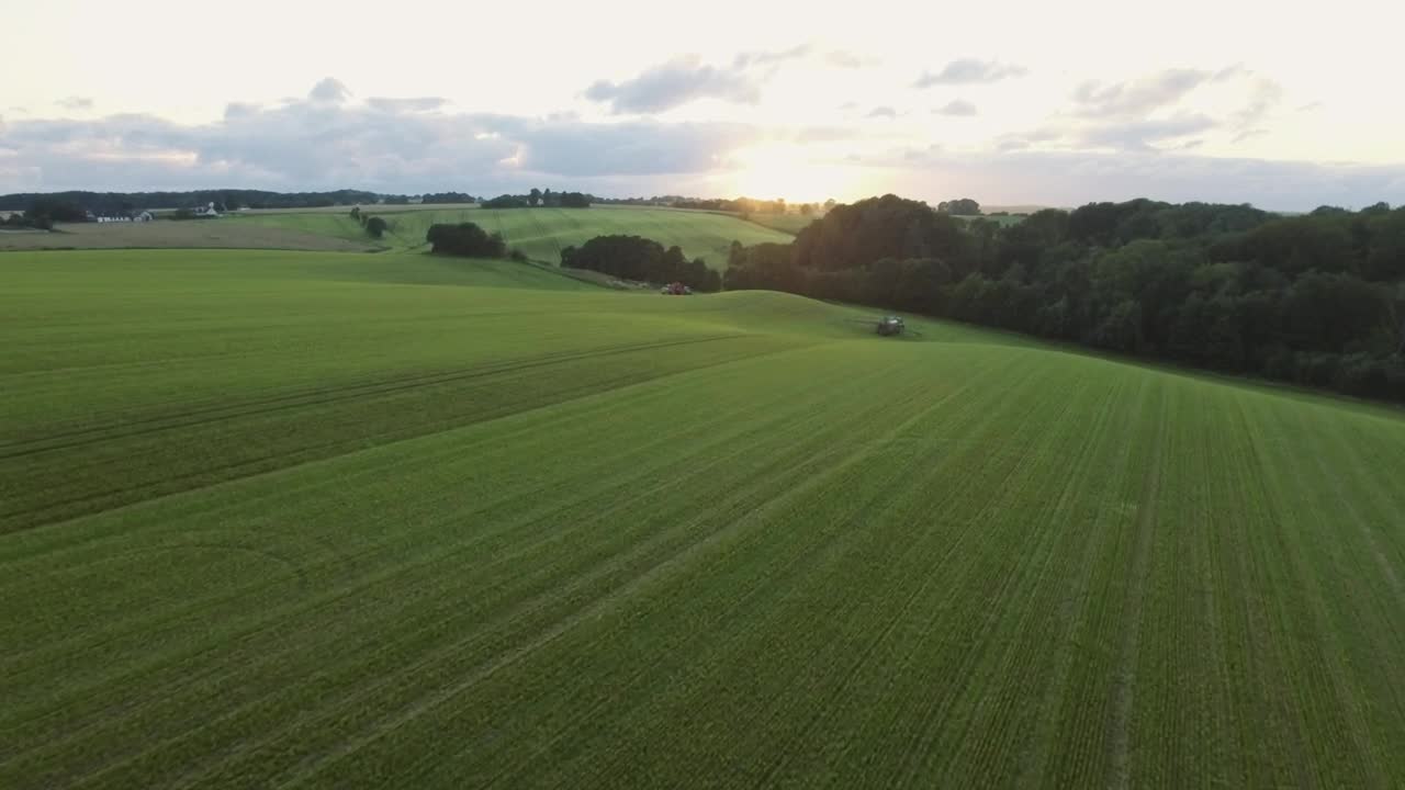 Free Video Stock tractor moving through a field Live Wallpaper