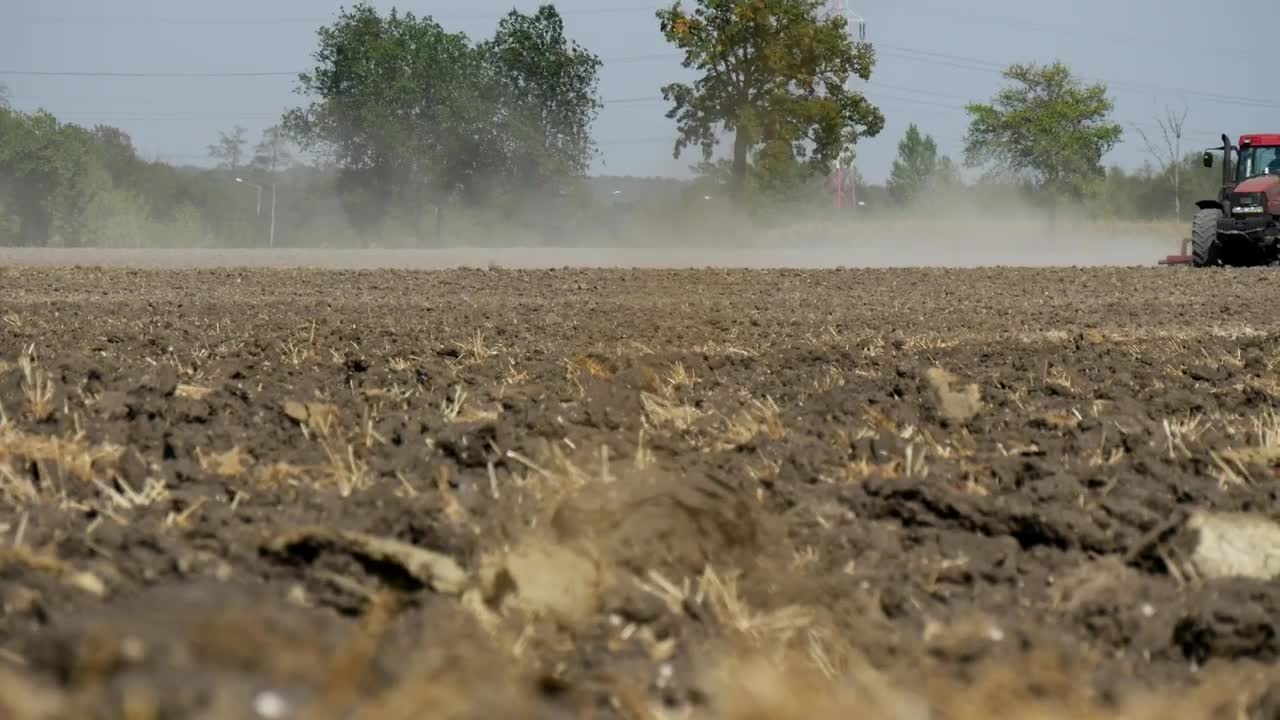 Free Video Stock tractor passing over a dirt field Live Wallpaper