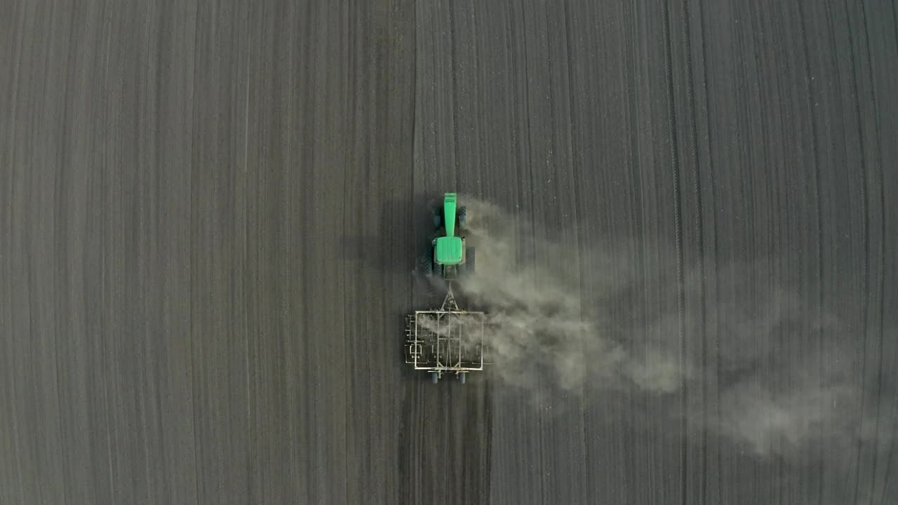 Free Video Stock tractor working in a dry field Live Wallpaper