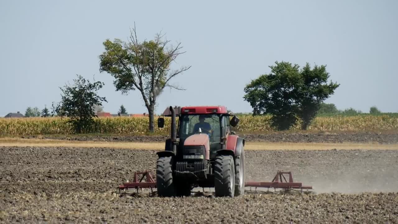 Free Video Stock tractor working on a field full shot Live Wallpaper