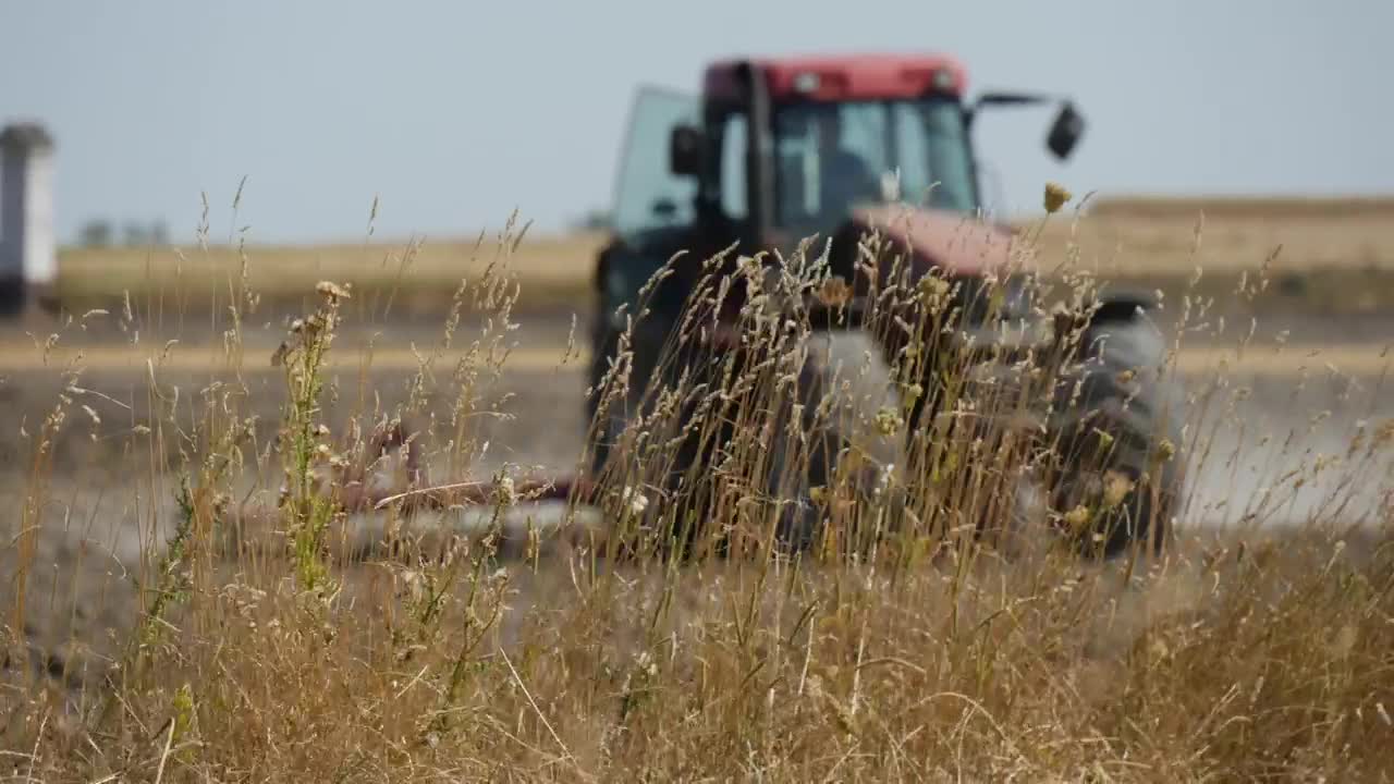 Free Video Stock tractor working on the agricultural field Live Wallpaper