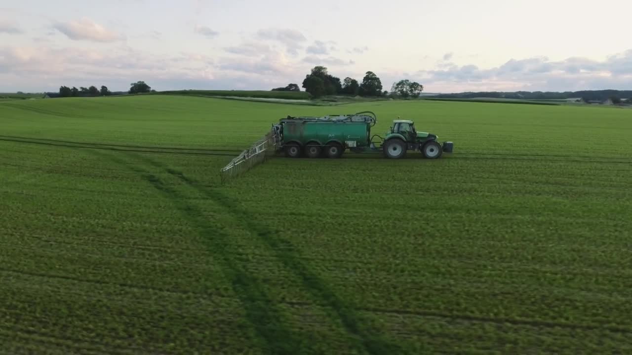 Free Video Stock tractor working on an agriculture field Live Wallpaper