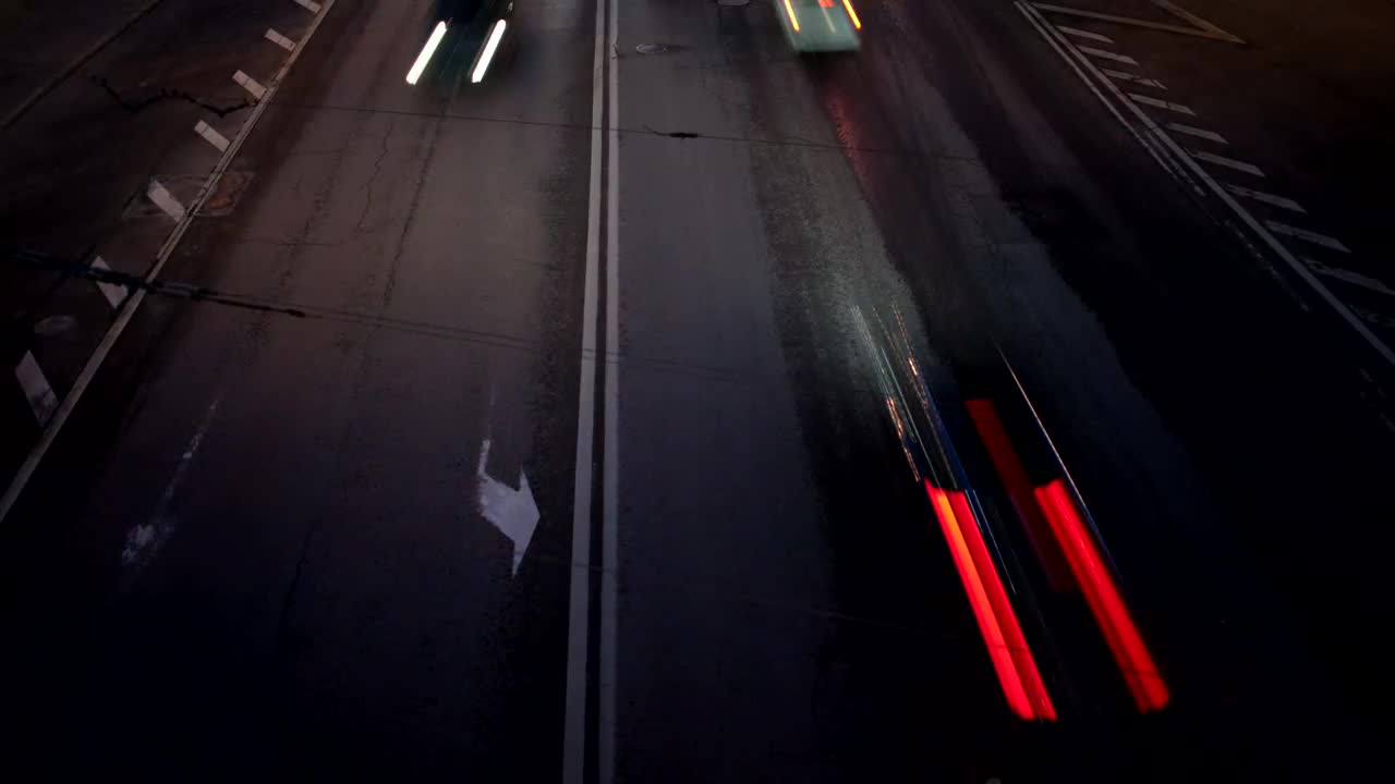 Free Video Stock traffic heading in two directions at night Live Wallpaper