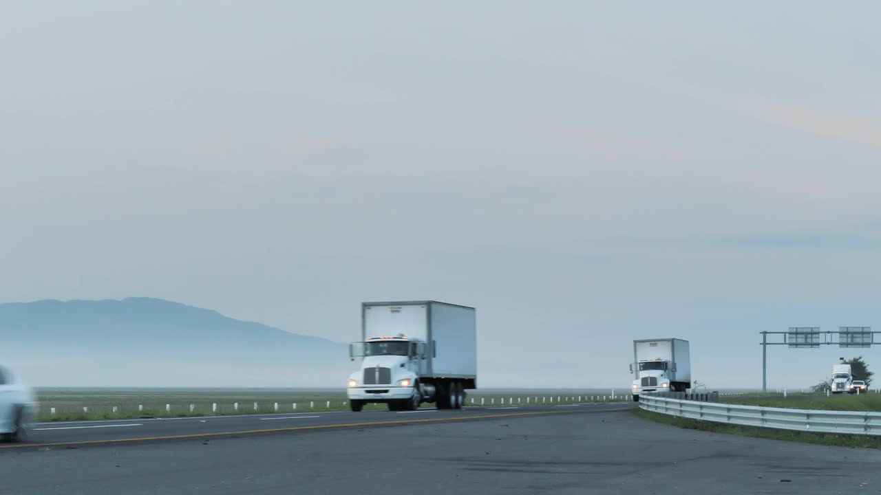 Free Video Stock trailers on a foggy road Live Wallpaper