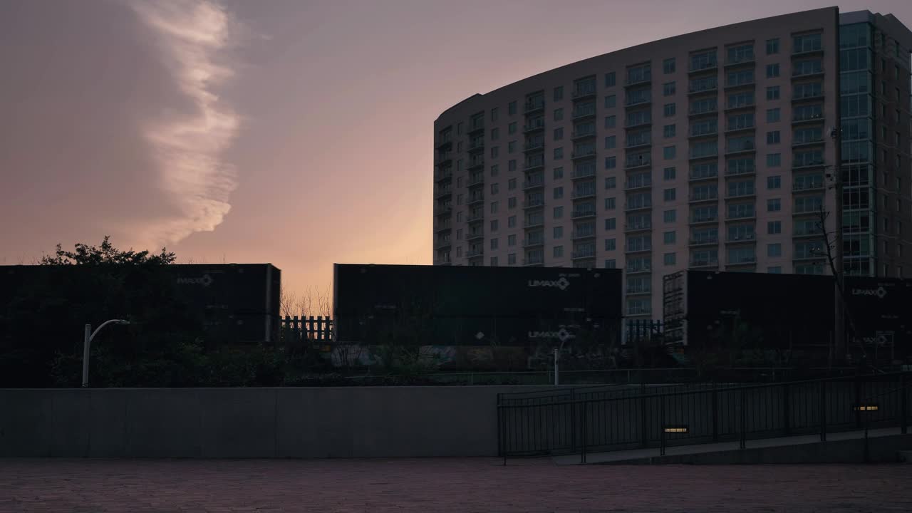 Free Video Stock train carriages moving forward in a city at sunset Live Wallpaper