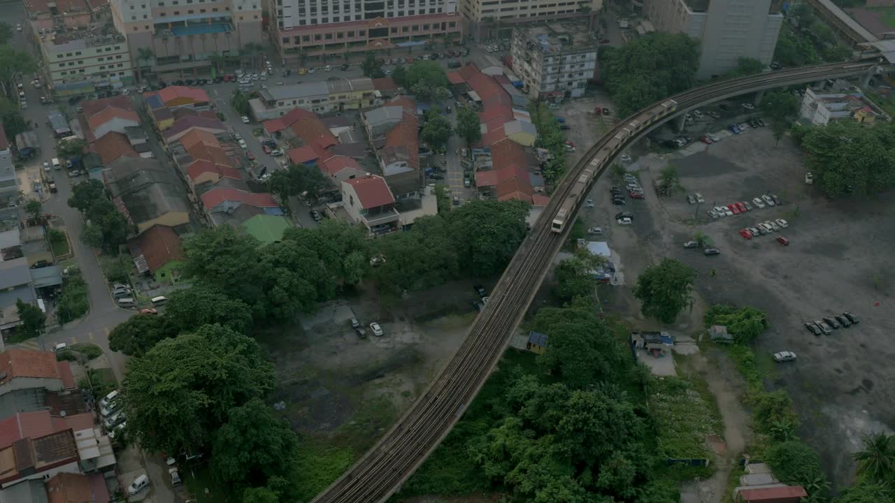 Free Video Stock train heading above a poor residential area Live Wallpaper