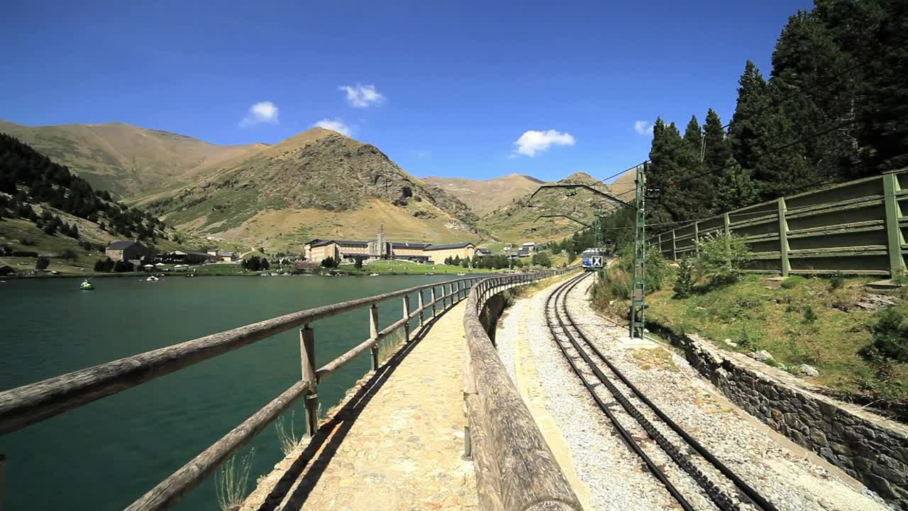 Free Video Stock train passing next to a river in the countryside Live Wallpaper