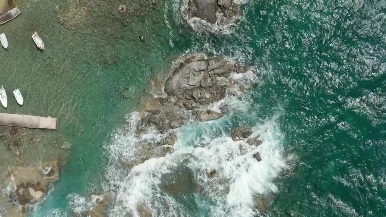 Free Stock Video Waves Breaking The Rocky Seashore Of A Tourist Port Live Wallpaper