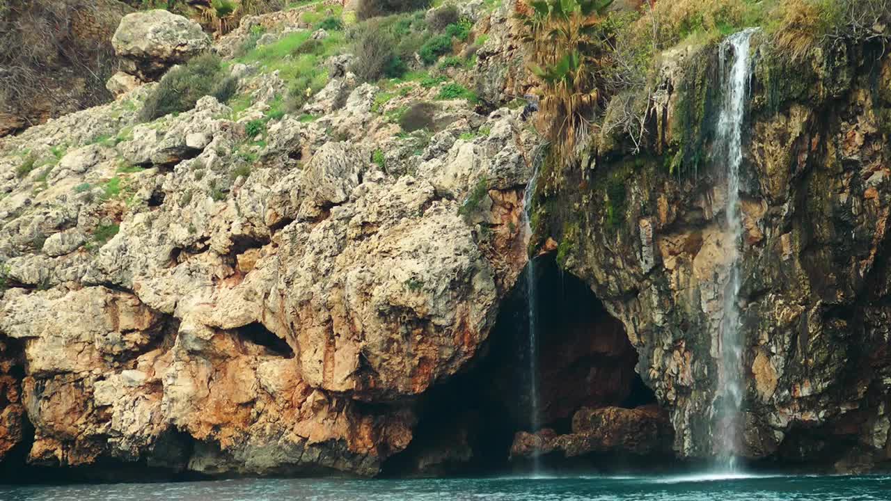 Free Stock Video Waterfall On A Rocky Shoreline By The Sea Live Wallpaper